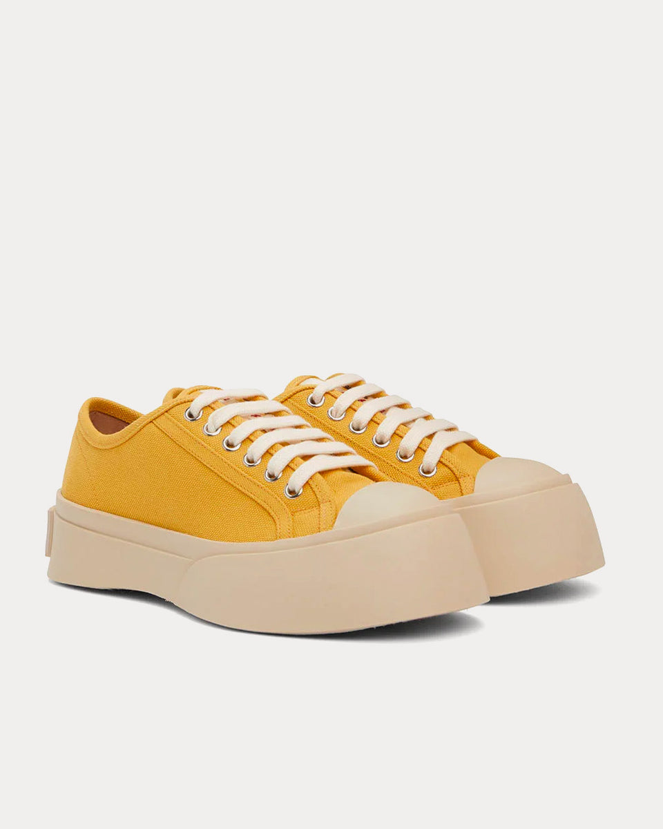 Yellow low top store sneakers