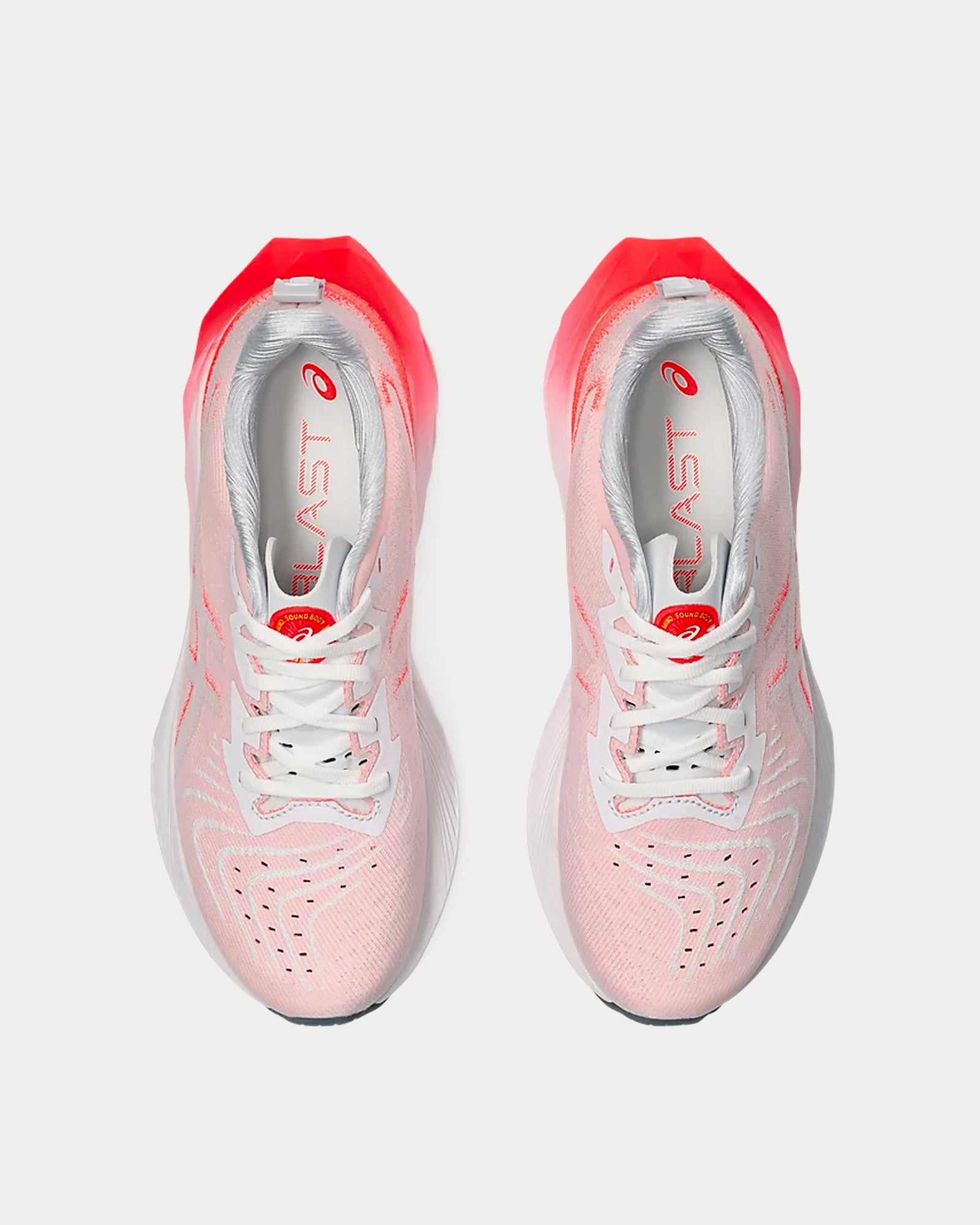 Red and white running shoes on sale