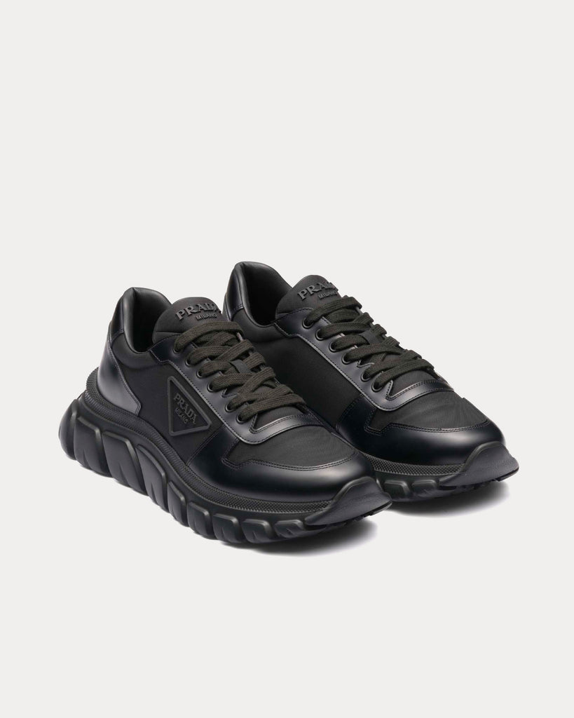 Logo leather low-top sneakers in black - Prada