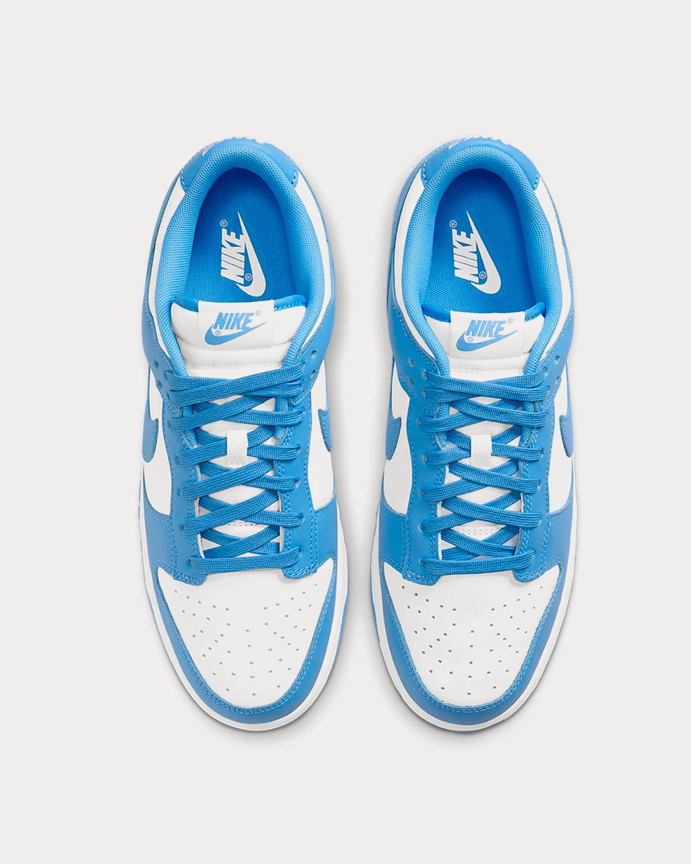 Nike Dunk Low Retro White / University Blue Low Top Sneakers - Sneak in  Peace